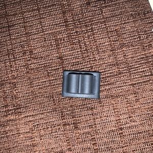 Dark grey AirPod hold for Apple Watch band